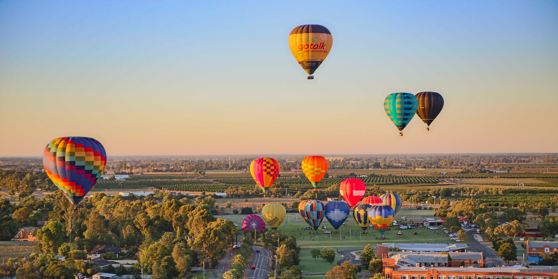 Hot air balloons float over Leeton Shire in NSW on a sunny day