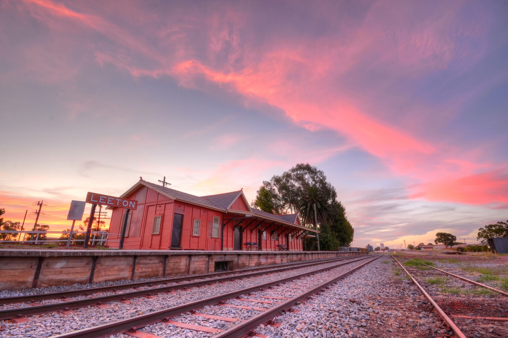 Leeton Train Station at sunset under a pink sky