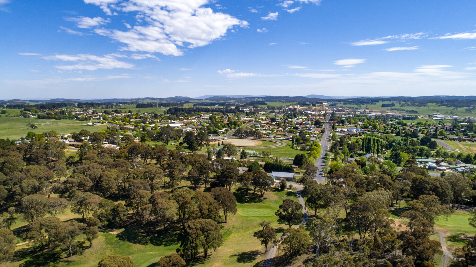 An aerial shot of Oberon town in NSW Central West taken on a sunny day with blue skies