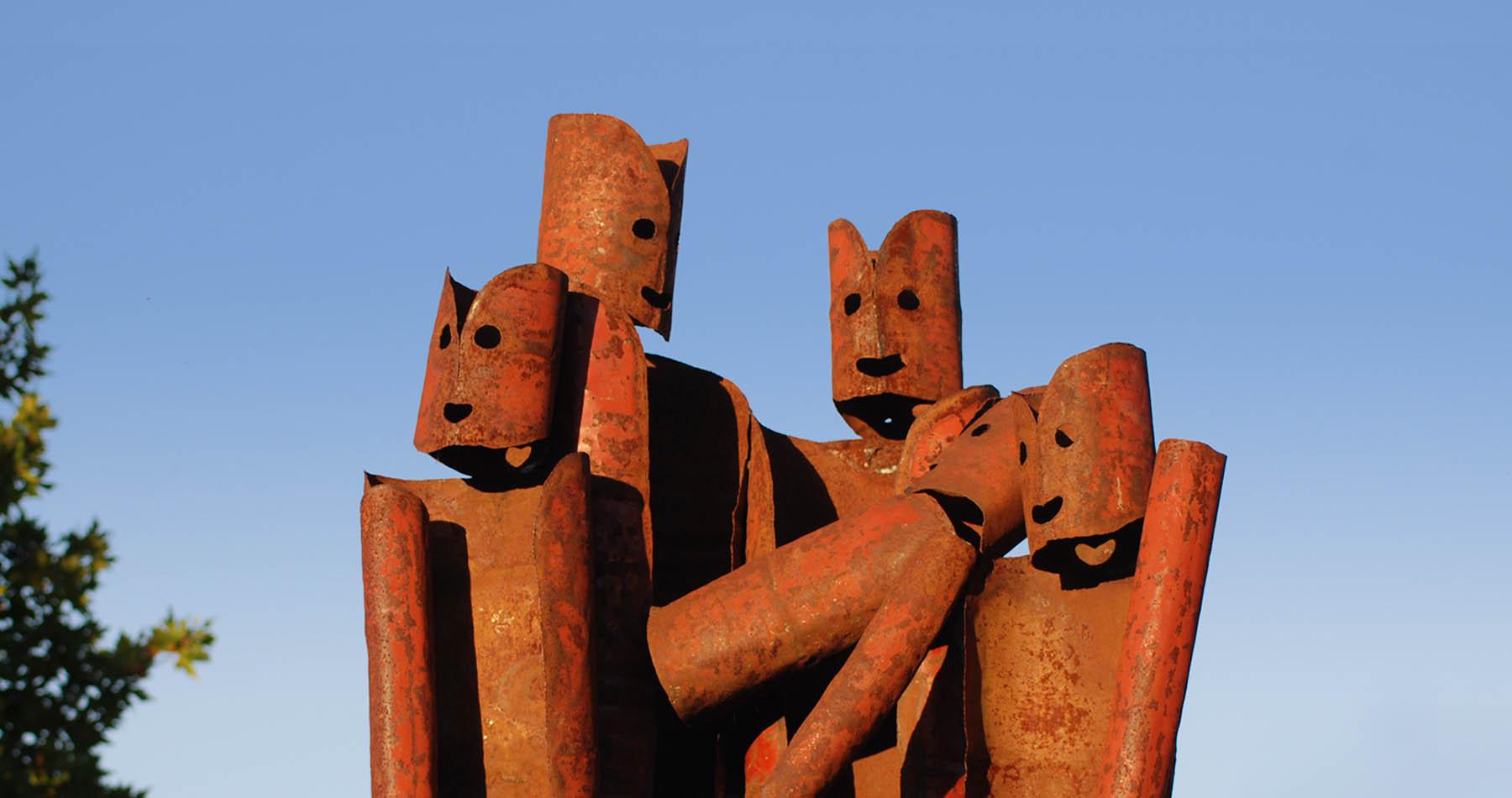 A group of people sculpted from iron on the Walcha Open Air Sculpture Trail