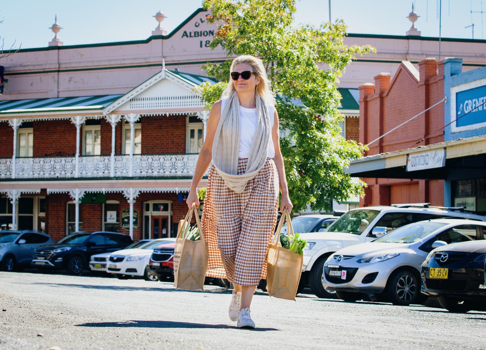 A woman shops for fresh local produce in Grenfell Weddin Shire NSW