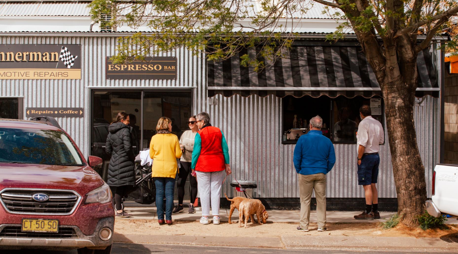 Locals in Grenfell NSW buying take away coffees from a local cafe