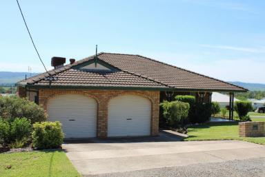 House Sold - NSW - Denman - 2328 - Well-presented and maintained four-bedroom brick veneer home set in west Denman with broad valley views Features Include:  (Image 2)