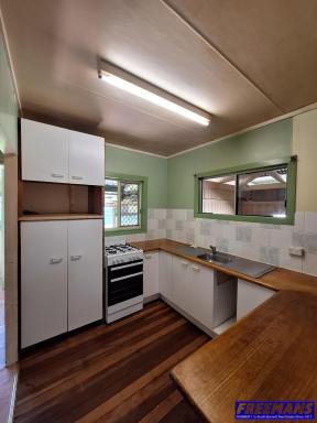 House For Lease - QLD - Nanango - 4615 - This 3-bedroom home sits on a half-acre block and offers a great opportunity for those needing outside space and storage  (Image 2)