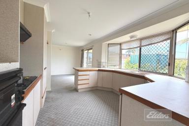 House For Sale - QLD - Tin Can Bay - 4580 - A Practical Home with Exceptional Garaging in the Heart of Tin Can Bay!  (Image 2)