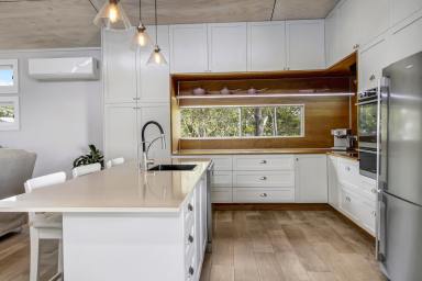 House For Sale - QLD - Macleay Island - 4184 - A home that keeps on giving: Water views, home theatre movie nights and a car enthusiast’s dream workshop (Image 2)