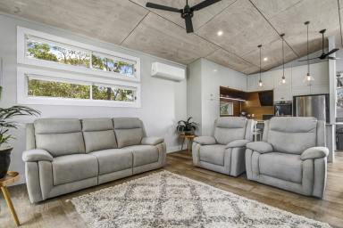 House For Sale - QLD - Macleay Island - 4184 - A home that keeps on giving: Water views, home theatre movie nights and a car enthusiast’s dream workshop (Image 2)